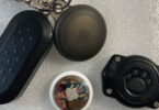 a key chain with a dog paw print watertight case and an Apple AirTag