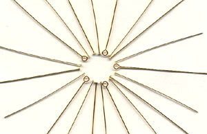 a group of gold filled pins in a circle