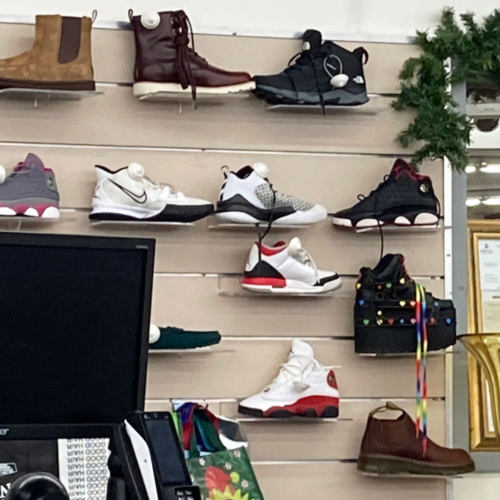 sneaker wall behind the checkout counter