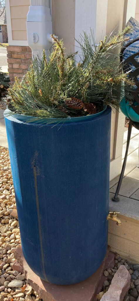 winterized rain barrel with a decorative top lid