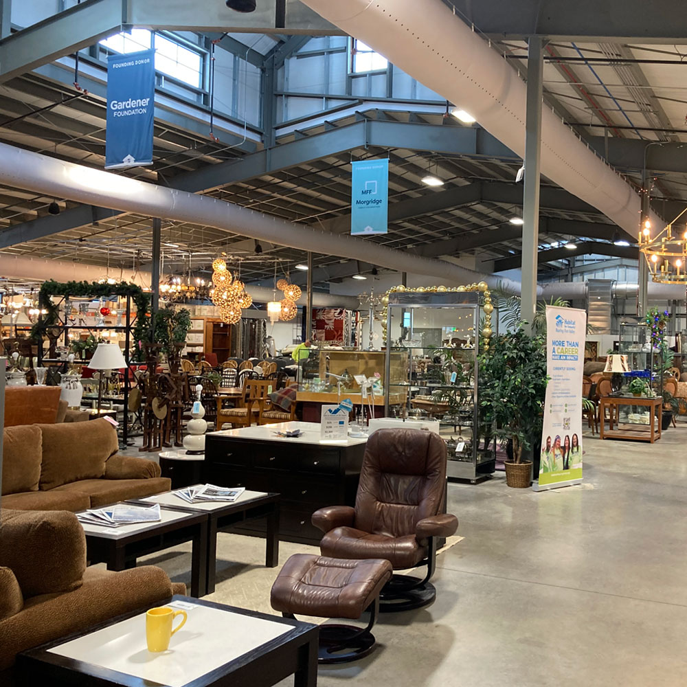 interior of restore thrift store with furniture and lighting