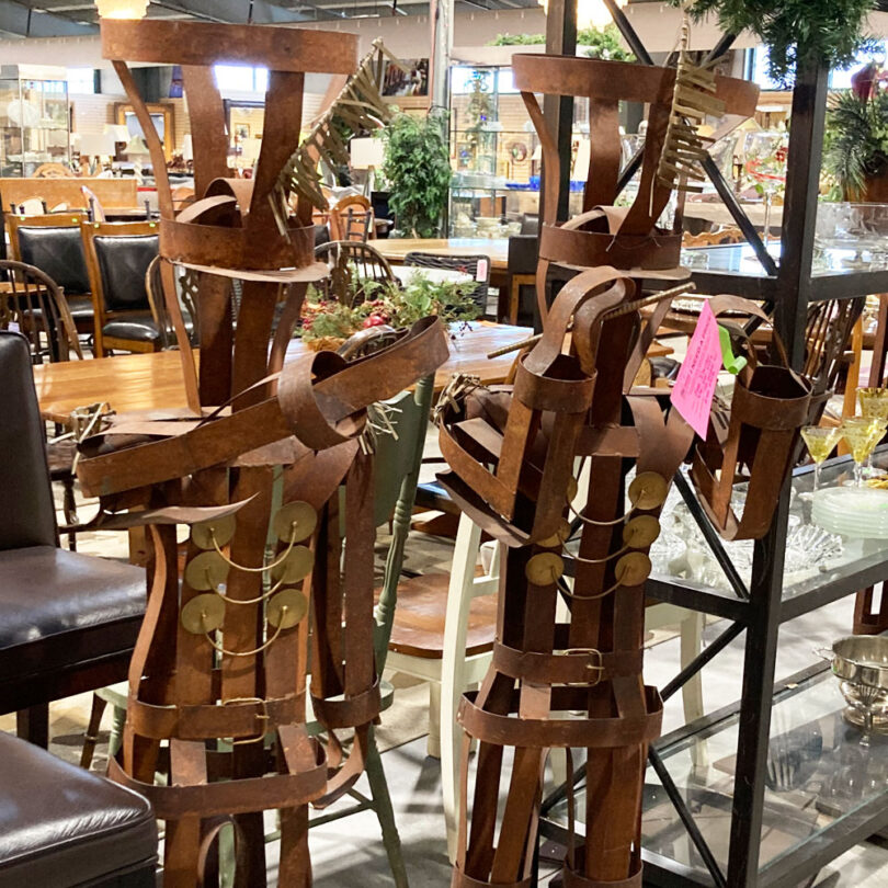 metal sculptures of figures playing instruments