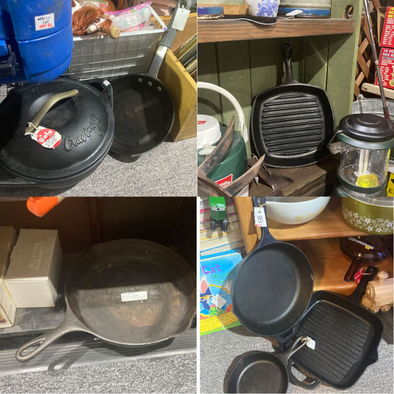 collection of cast iron skillets pots at an antique marketplace