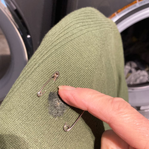 dish soap rubbed into laundry stain for removal