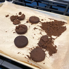 drying used coffee grounds on cookie sheet