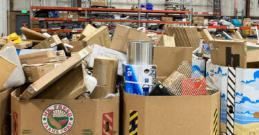 diverse products piled in gaylord boxes for the thrift store junkie