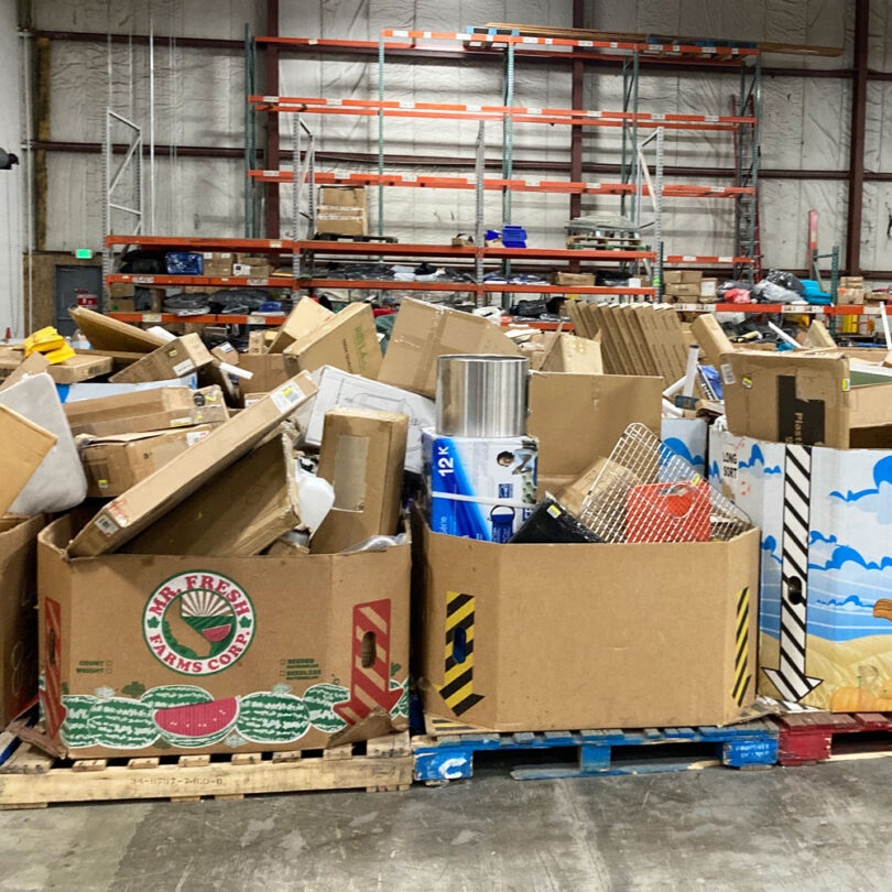 diverse products piled in gaylord boxes for the thrift store junkie