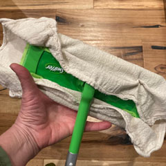 swiffer dry mop with a shop towel cover
