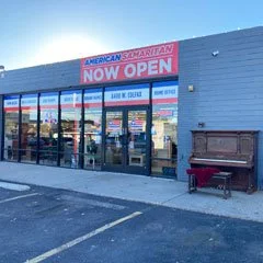 old upright piano outside store acts as a billboard