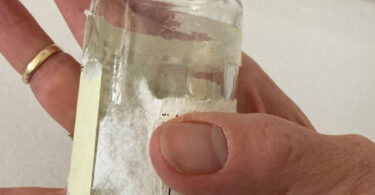 how to remove sticky residue from surfaces of this jar