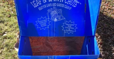 blue leaf bag chute with a brown leaf bag on grass