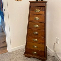 bare corner with stack of drawers cabinet