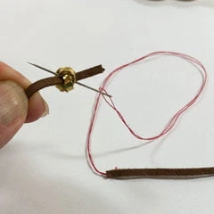 sliding knot adjustable length necklace needle and thread to pull leather through bead hole
