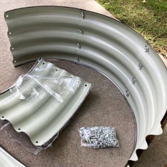 assembling pieces of a raised bed planter