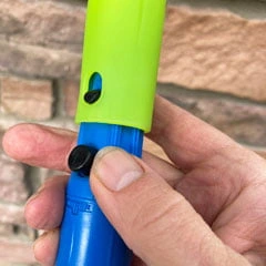 tab holds tool onto extension pole